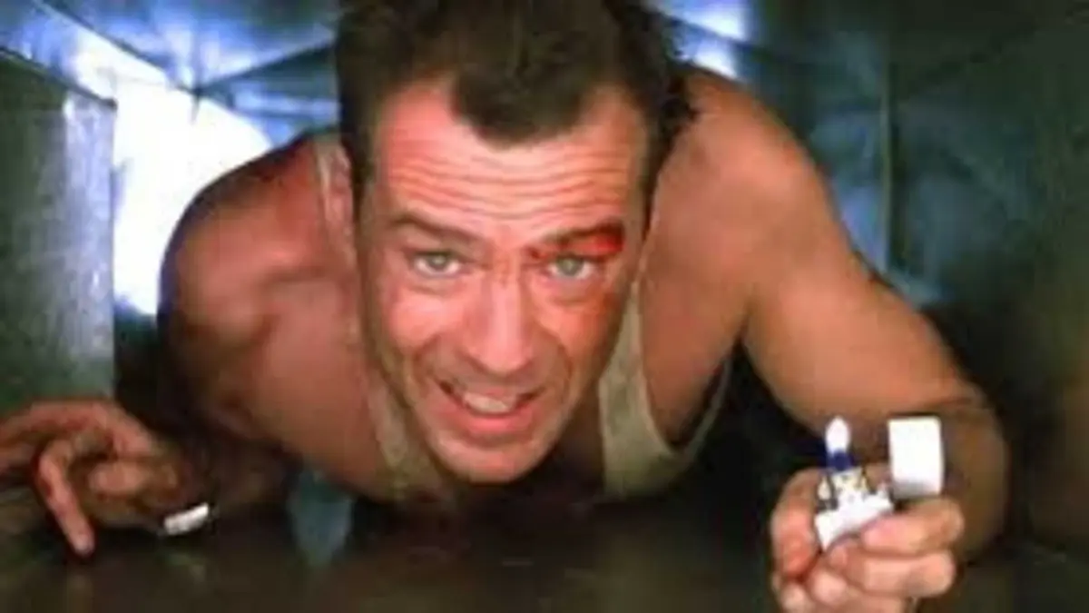 Bruce Willis as John McClane in Die Hard (1988)