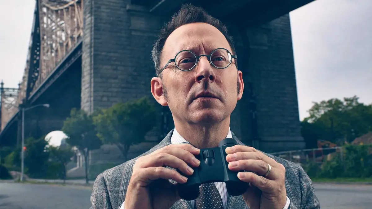 Michael Emerson as Harold Finch holding a pair of binoculars in Person of Interest