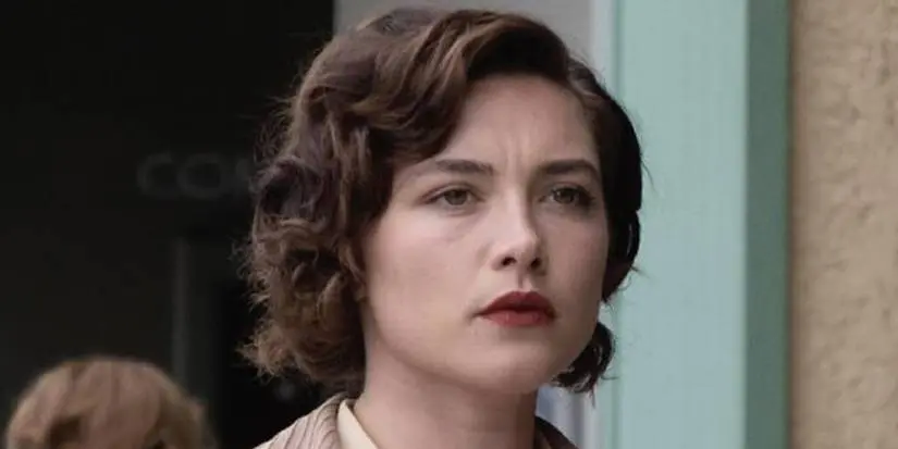 Jean Tatlock (Florence Pugh) looking at something in Oppenheimer.