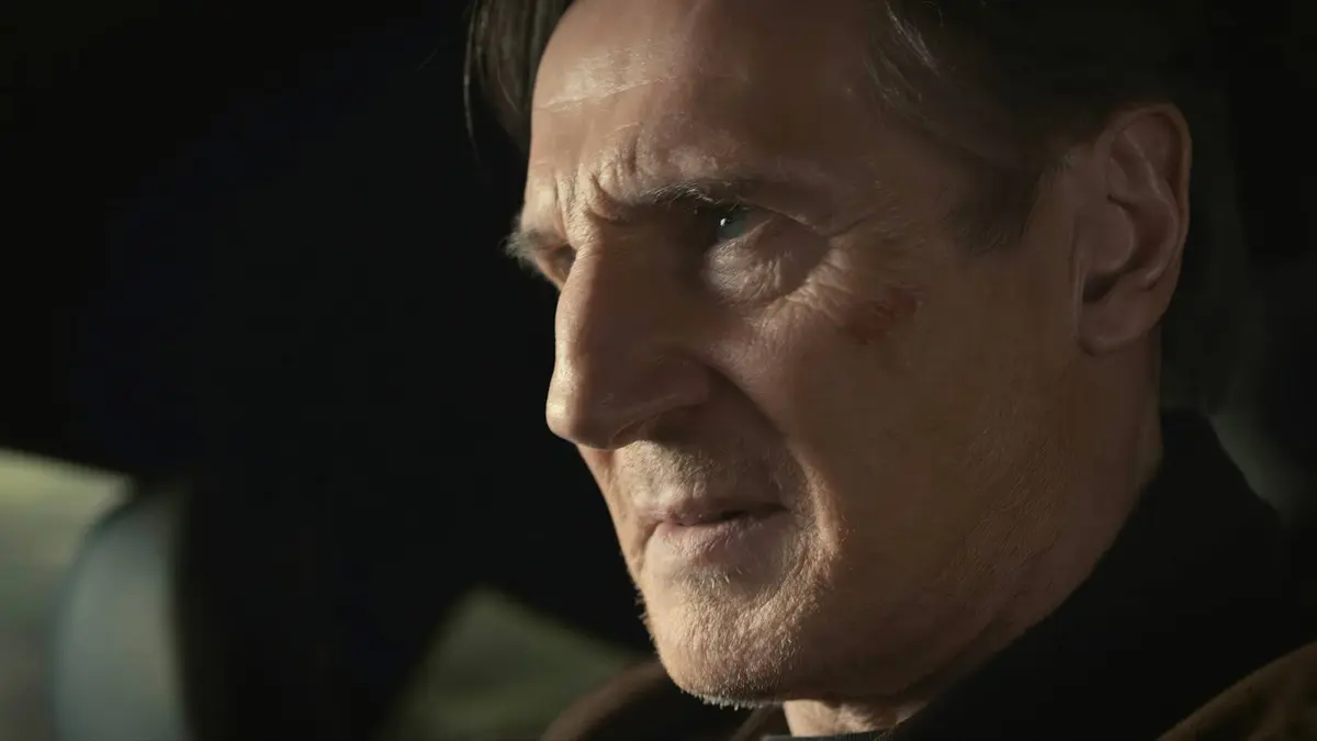 Liam Neeson scowling in close-up in The Mongoose