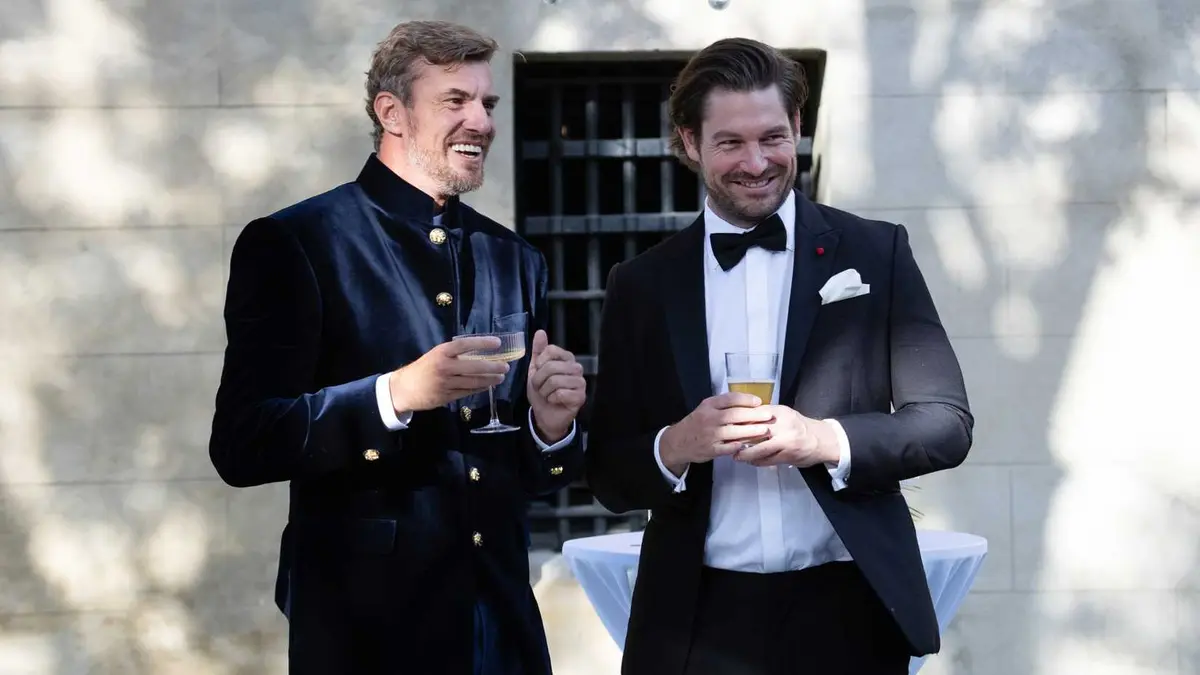 Shep Rose and Craig Conover dressed formally, holding drinks in Southern Charm