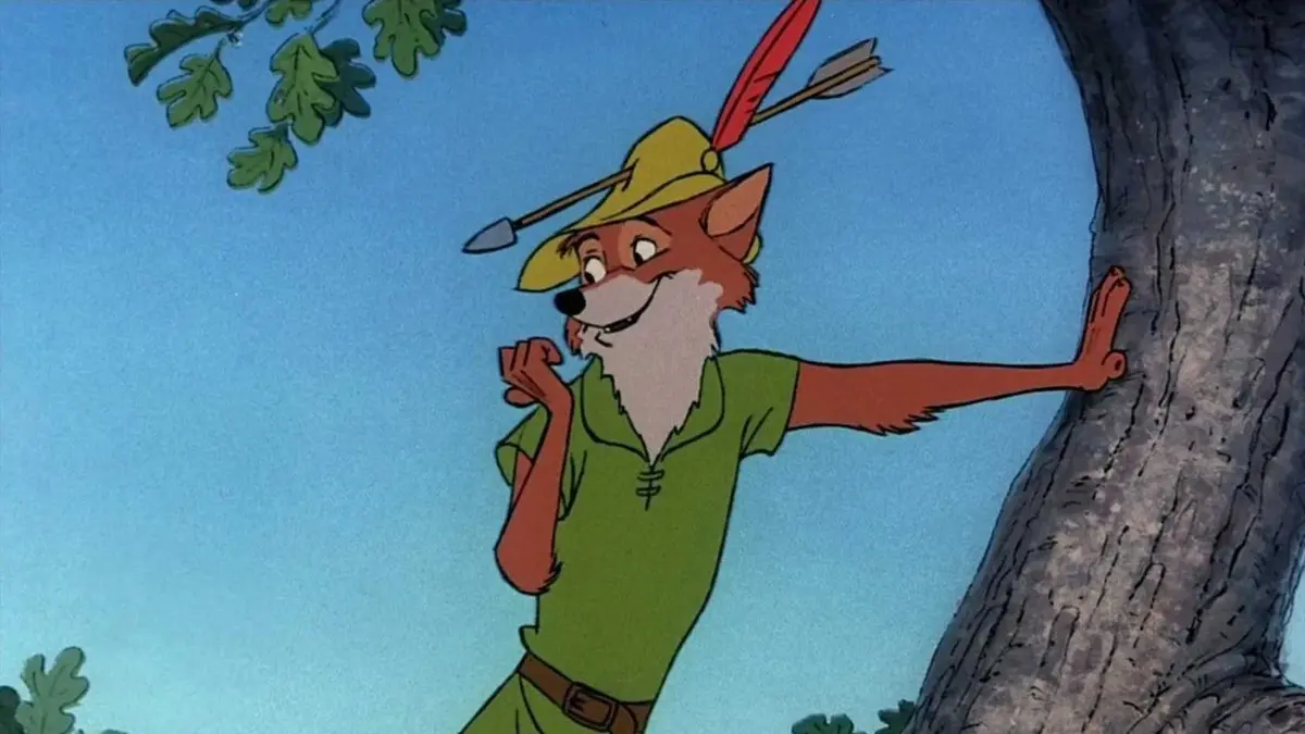 Robin Hood leans against a tree in the Disney movie