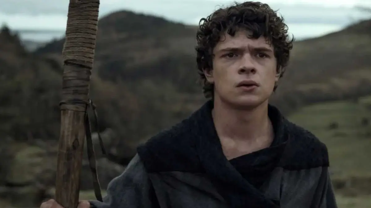 Noah Jupe holds a staff in The Death of Robin Hood