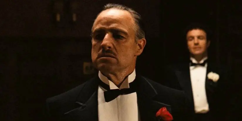 Marlon Brando standing in his office in The Godfather