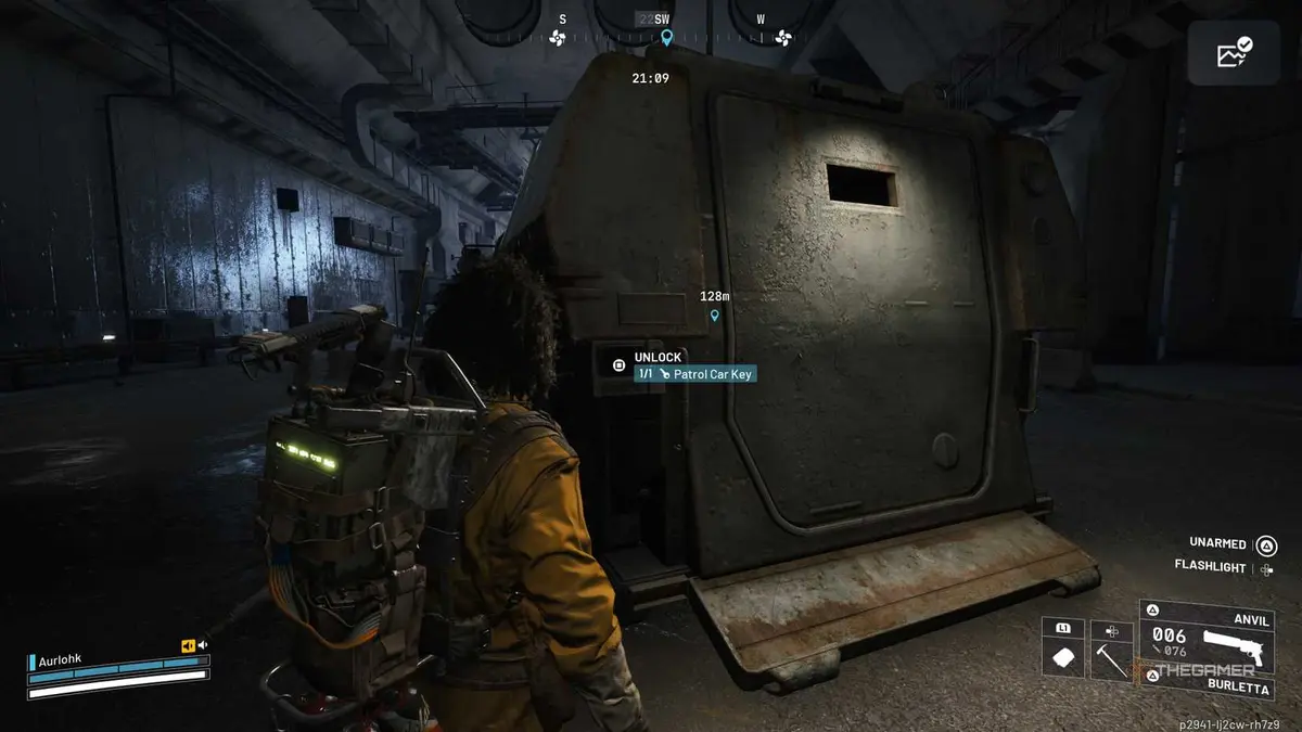 Player raider standing next to an abandoned armored car with a blue unlocking prompt in Arc Raiders.