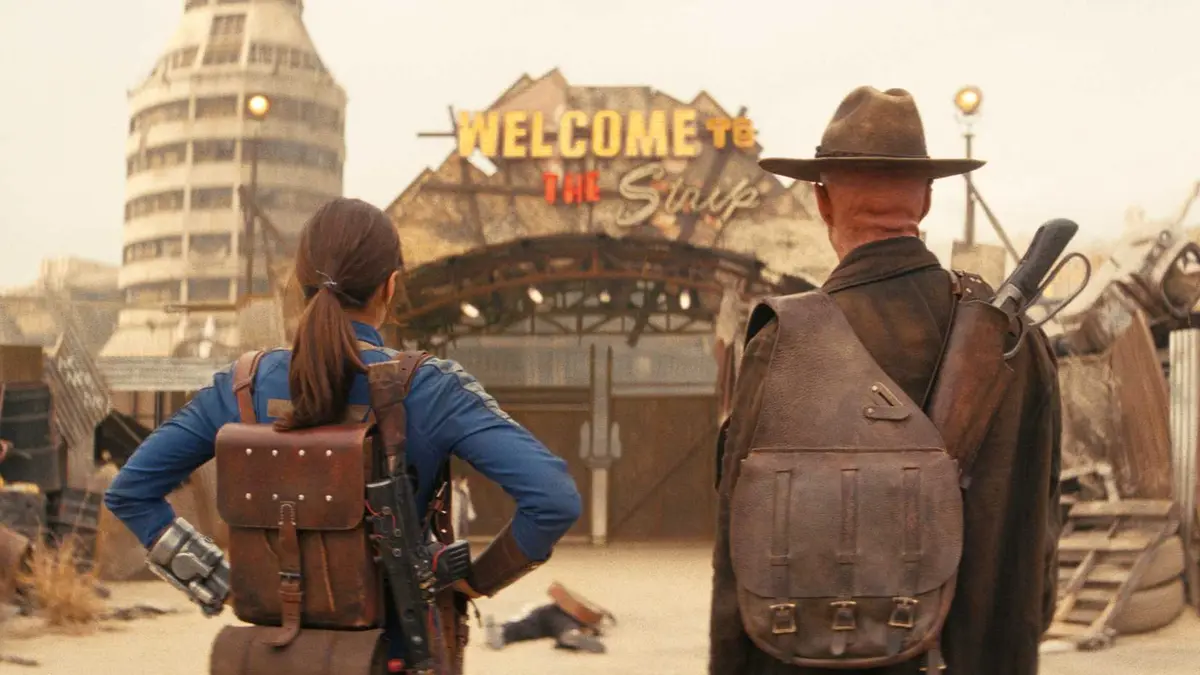 Lucy and The Ghoul stare at the New Vegas Strip gate in Fallout season 2