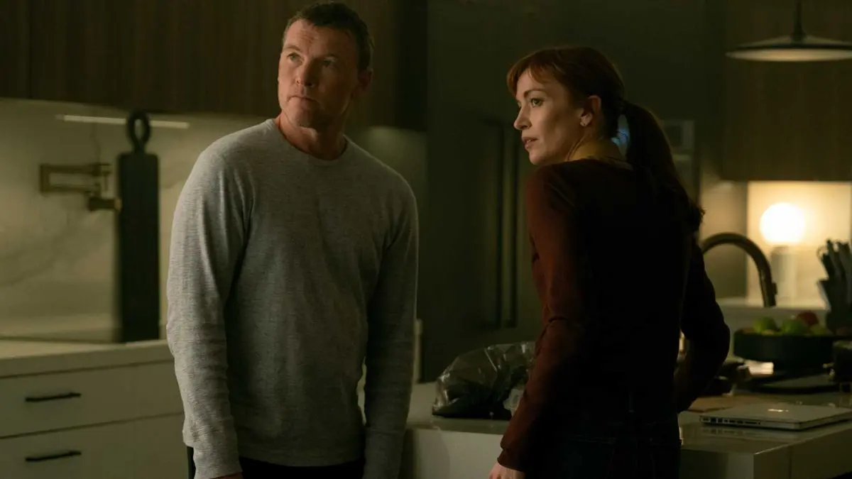 Sam Worthington as David Burroughs and Britt Lower as Rachel Mills in the kitchen on Harlan Coben's I Will Find You.