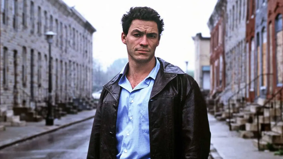 Dominic West standing in the middle of a street in HBO's The Wire