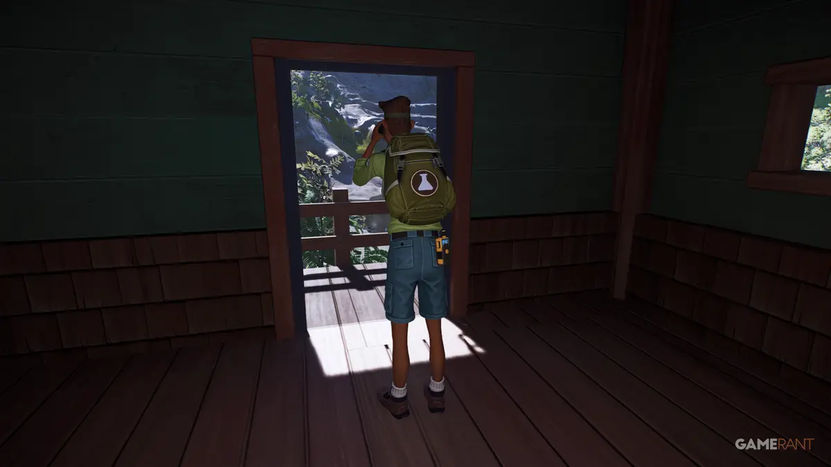 keeper in planet zoo 2 looking out of a research post door with binoculars