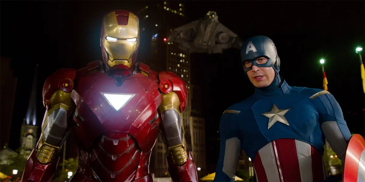 Iron Man and Captain America stand over Loki in The Avengers movie