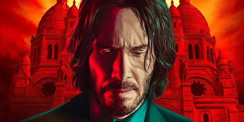 John Wick looking downward with red Eastern European buildings in background