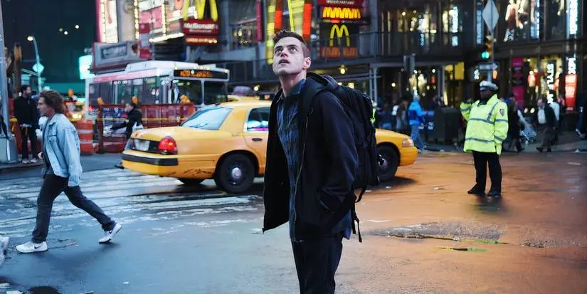 Elliot looking up at a billboard in Mr Robot season 1