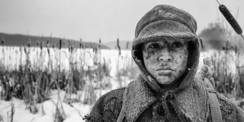 the painted bird 2019 shows Petr Kotlár in a black and white photo covered in mud/blood
