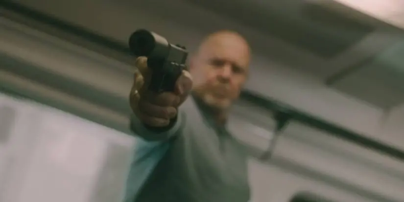 Chernitsky in Slow Horses holding a gun
