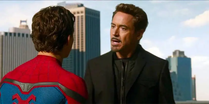 Peter Parker speaks to Tony Stark on a rooftop in Spider-Man: Homecoming