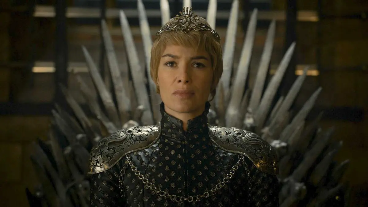 Lena Headey as Cersei Lannister sitting on the Iron Throne in Game of Thrones
