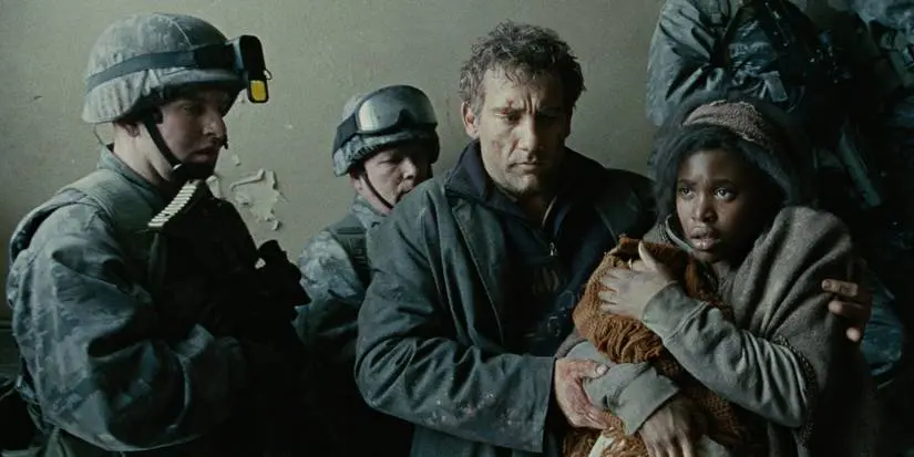 Theo and Kee are escorted by soldiers in Children of Men