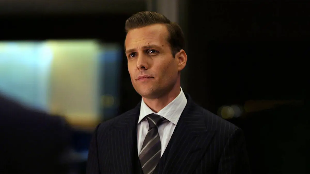 Gabriel Macht looking solemn as Harvey Specter in Suits.