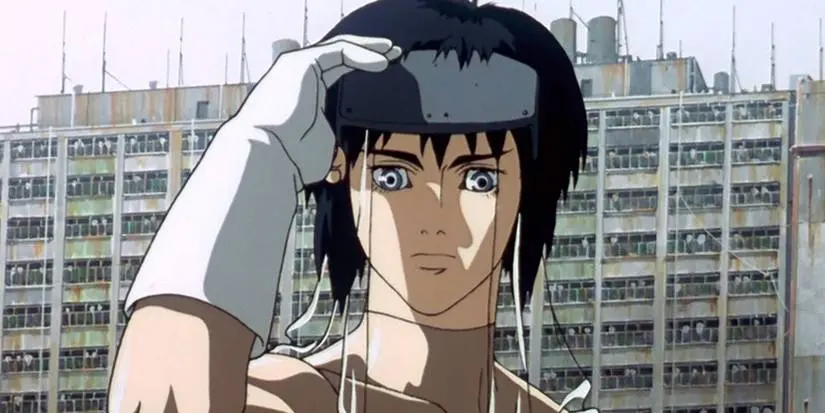 The Major removing her goggles to look at something in Ghost in the Shell (1995)