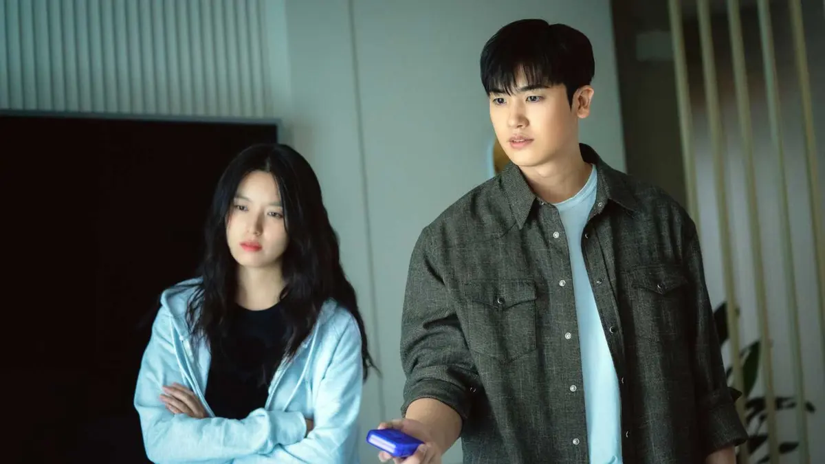 A young woman and a man looking stern in the horror K-Drama Happiness.