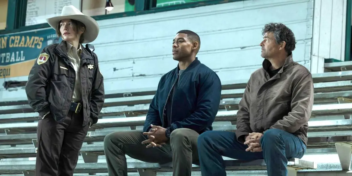 Hal, John, and Sheriff Kane together on some bleachers in Lanterns.
