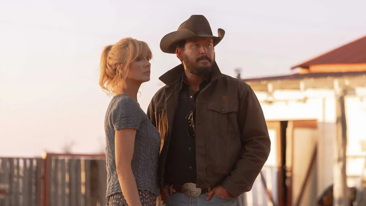 Kelly Reilly and Cole Hauser look off into the distance in Dutton Ranch