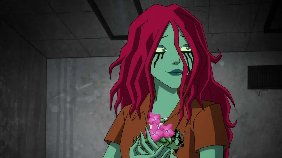 Poison Ivy holds a plant while smiling with mascara running down her face in the episode "All The Best Inmates Have Daddy Issues" in HBO's Harley Quinn