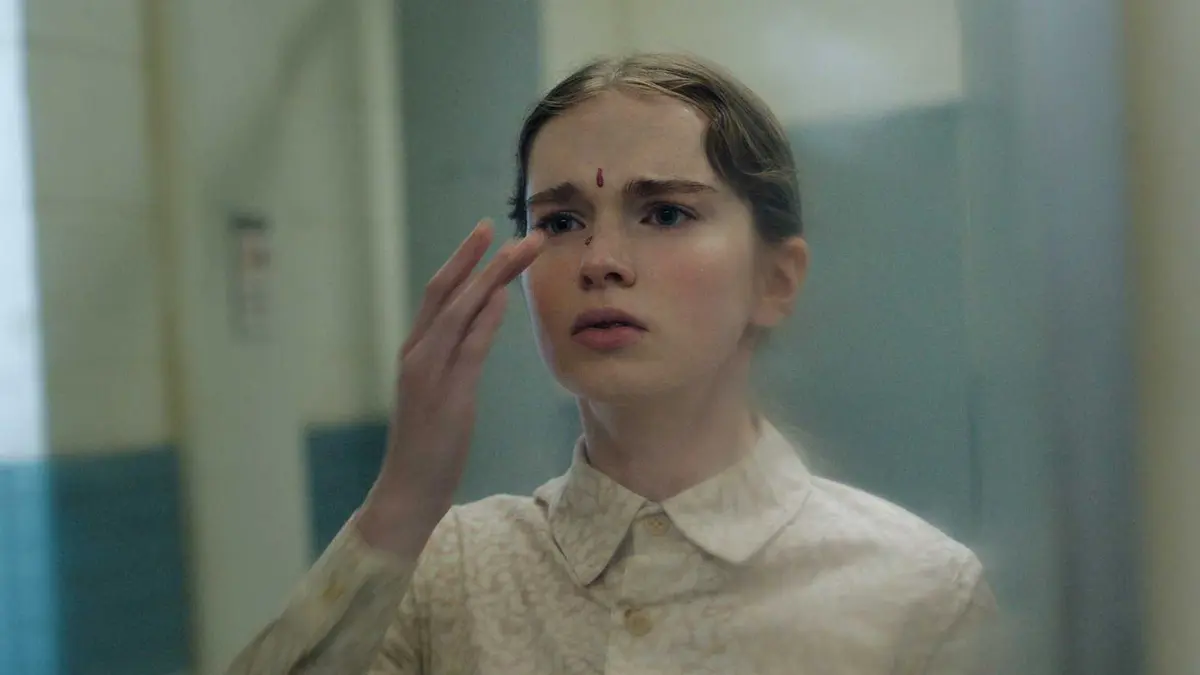 Carrie with a drop of blood on her face in Prime Video's Carrie TV show