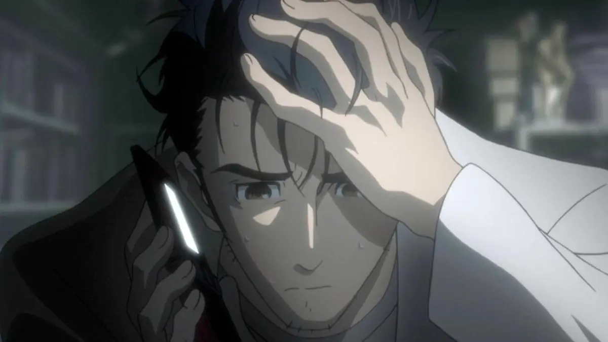 Rintaro Okabe is stressed while he takes a call in Steins;Gate.