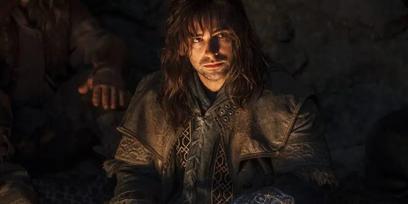 Kili looks up from a fire in The Hobbit
