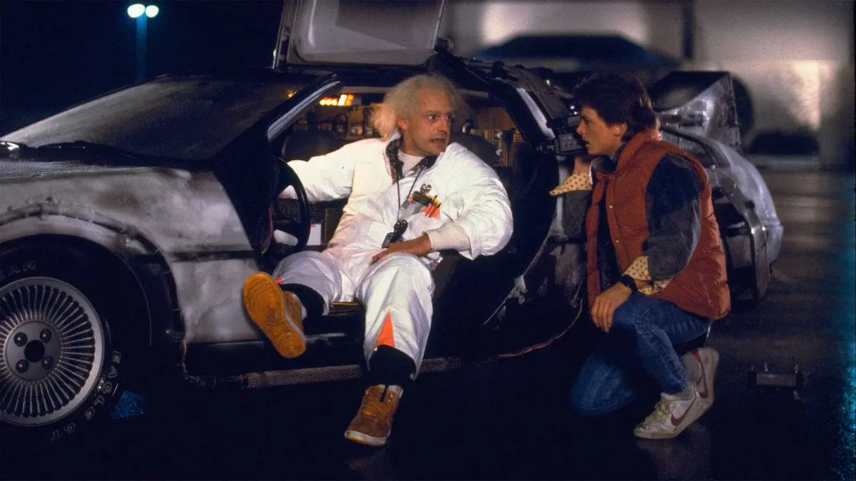 Doc and Marty McFly sitting in the DeLorean in Back to the Future