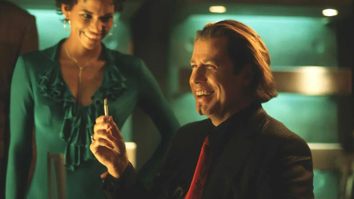 Ginger and Gabriel laugh in the movie Swordfish