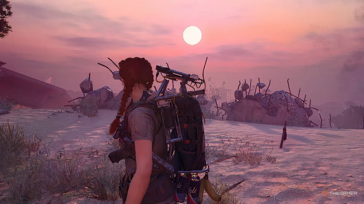 Arc Raiders A raider staring at the sunsset in the Buried City.