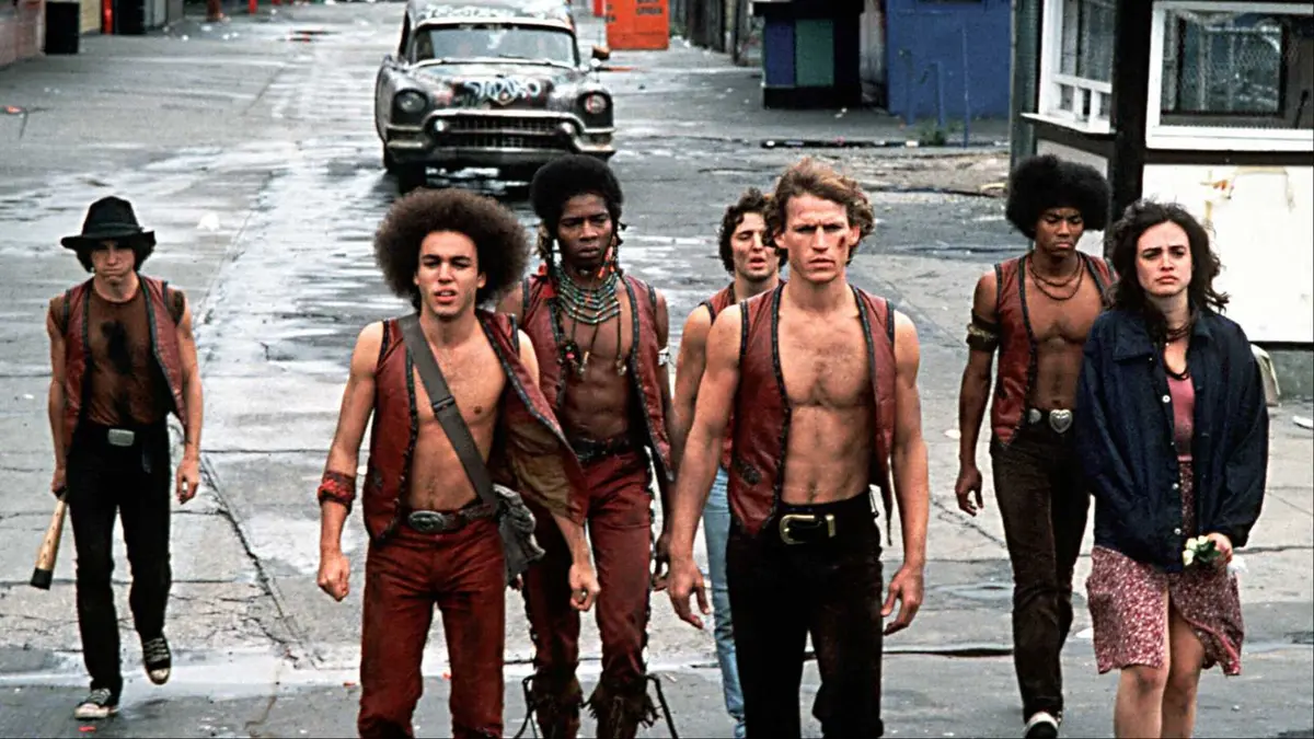 The titular Warriors walking on a deserted road