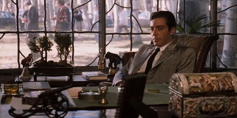 Michael Corleone (Al Pacino) sitting at his desk in The Godfather Part II (1974).
