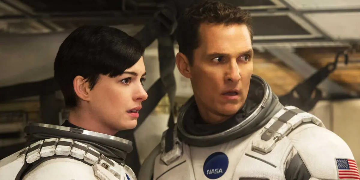 Joseph Cooper (Matthew McConaughey) and Amelia Brand (Anne Hathaway) in space suits in Interstellar.