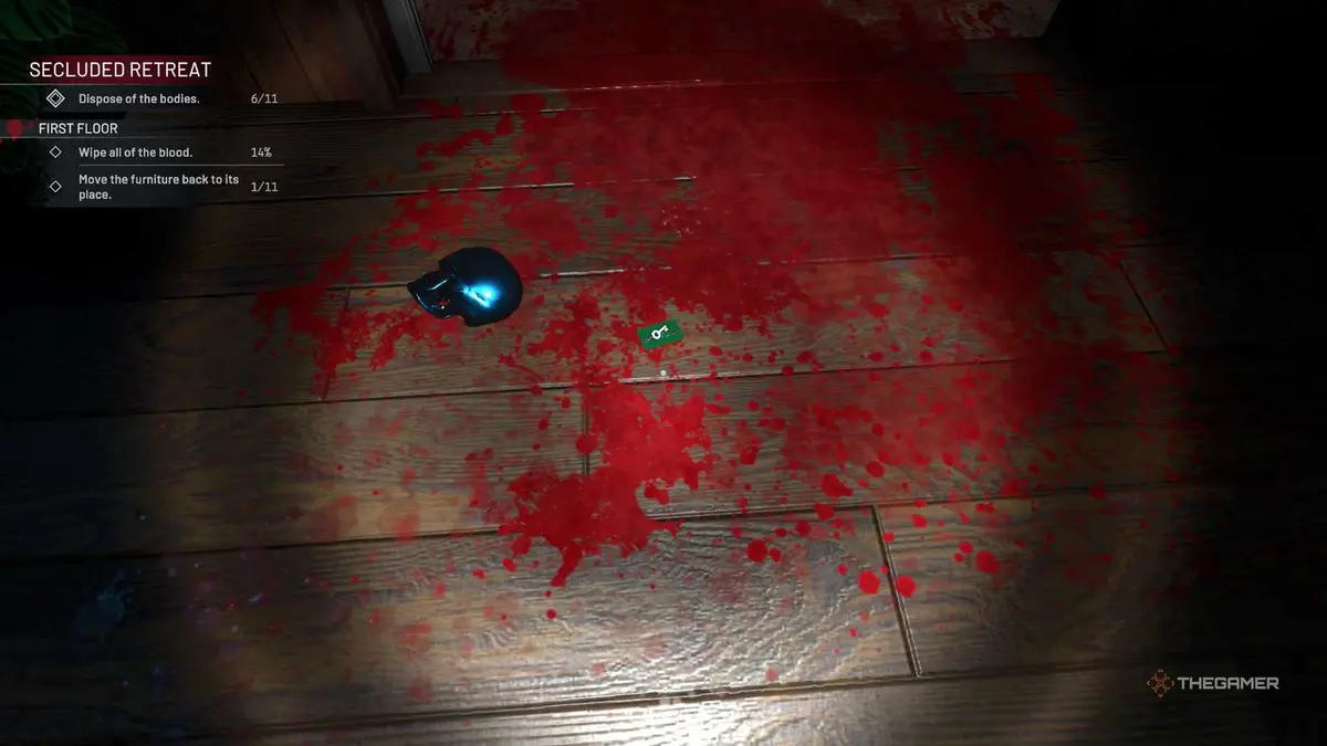 Crime Scene Cleaner blood splatter with skull statue and green keycard.