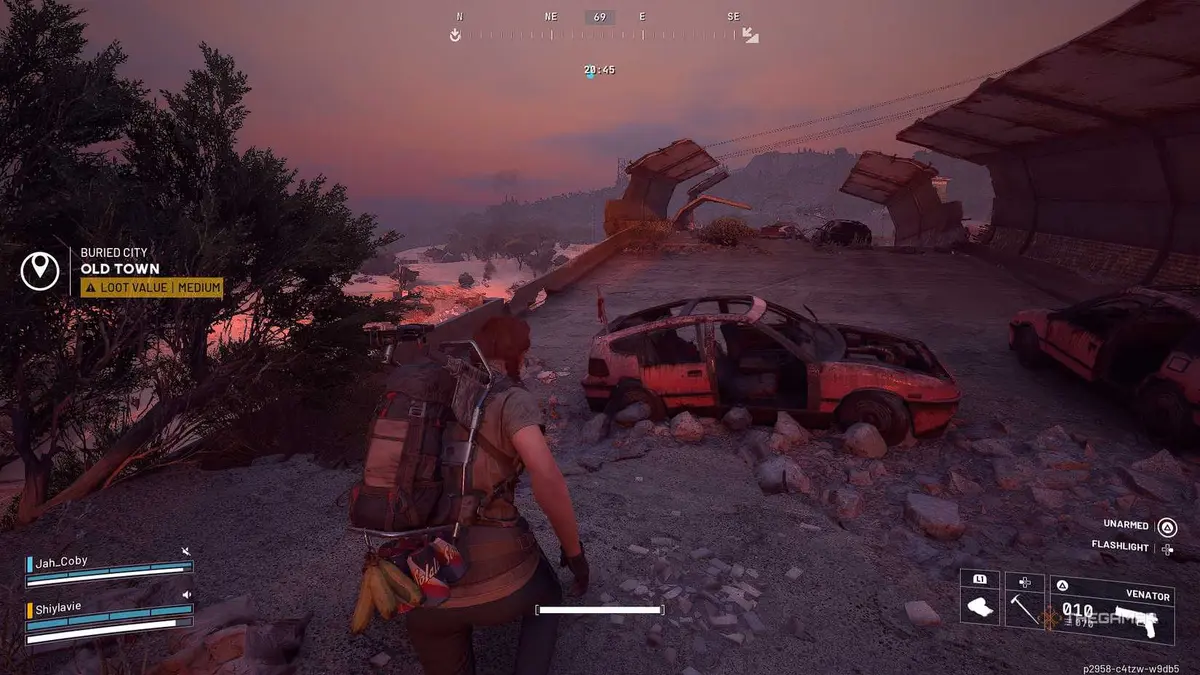 ARC Raiders in the buried city, following a trail of red ribbons on cars.