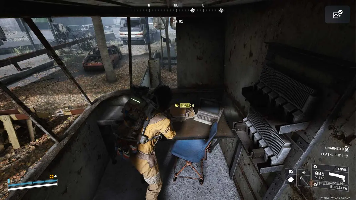 Player raider searching through a pile of yellow folders in a guard shack in Arc Raiders.