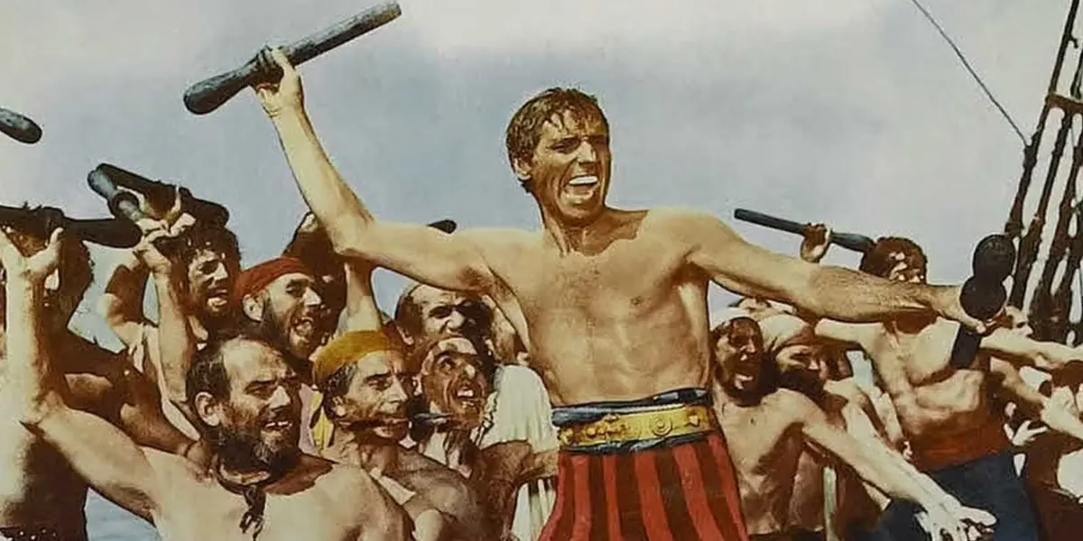 Shirtless pirates preparing for a fight in The Crimson Pirate
