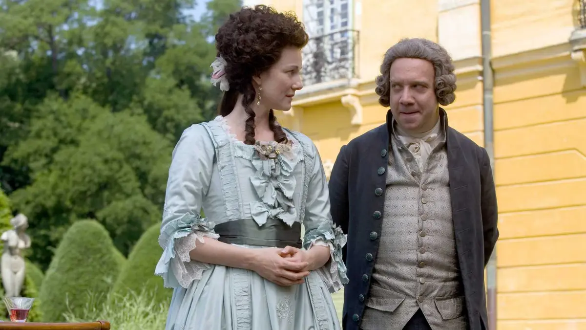 John and Abigail Adams looking at each other conspiratorially in HBO's John Adams