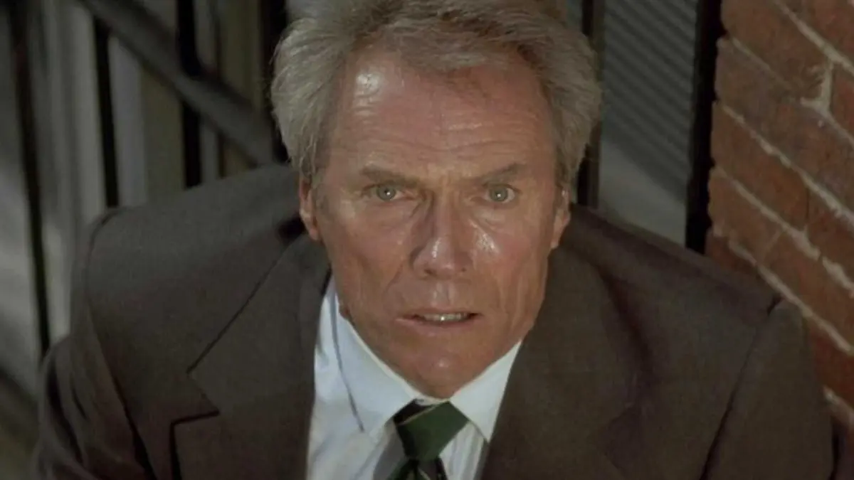 Clint Eastwood staring intensely with worry in In the Line of Fire