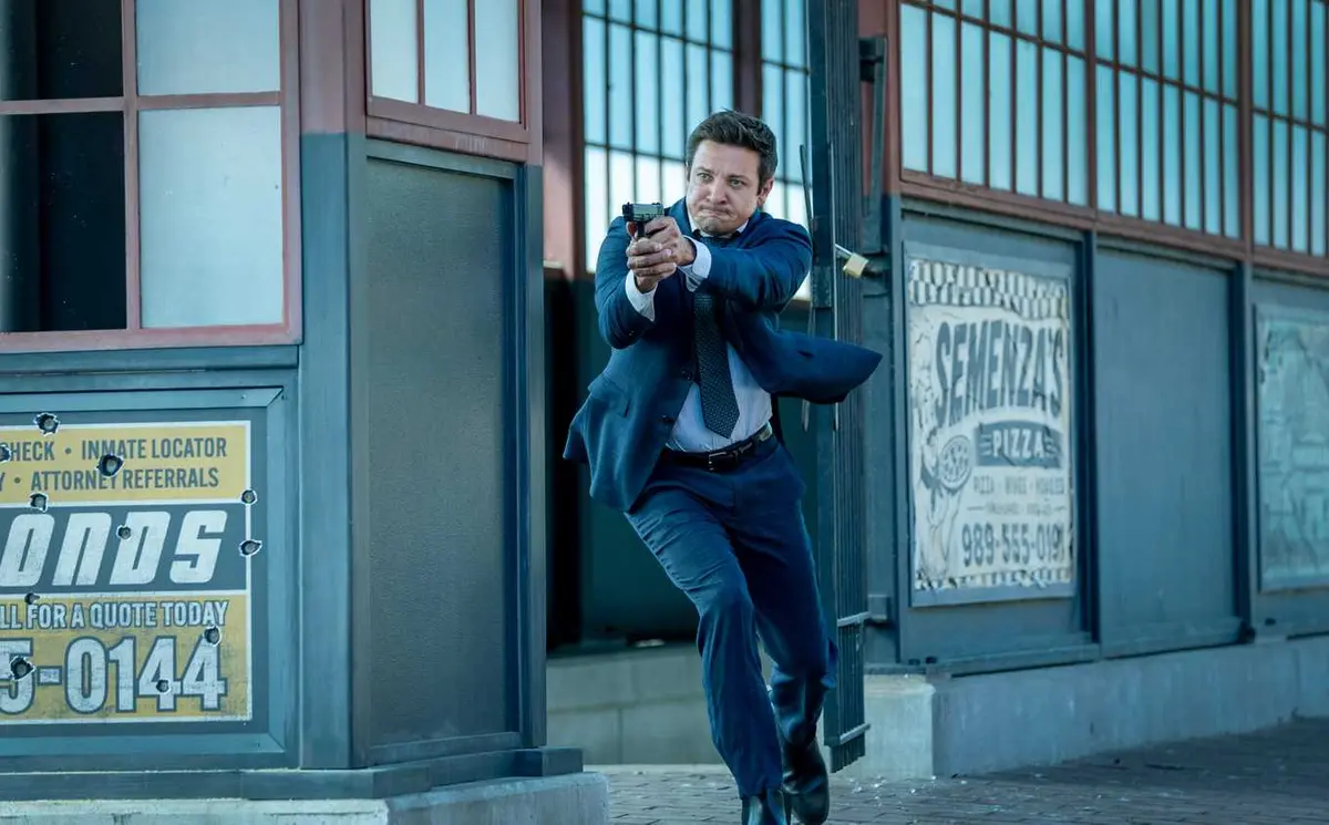 Jeremy Renner aiming a gun in Mayor of Kingstown season 5