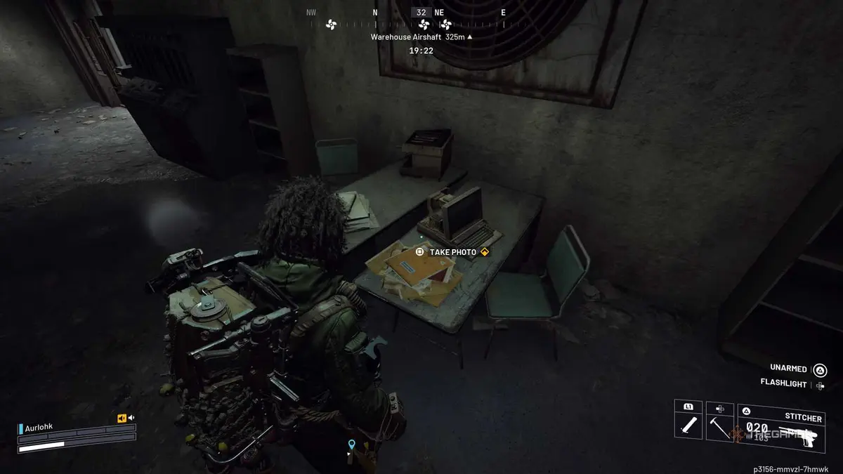 Player Raider standing next to a stack of yellow folders on a desk in the Maintenance Bunker with a prompt above them in Arc Raiders.
