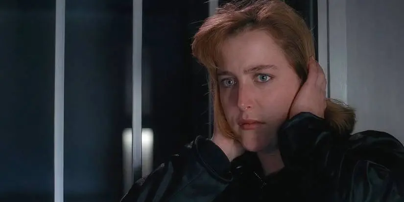 Agent Dana Scully (Gillian Anderson) covers her ears in The X-Files episode "Beyond the Sea."