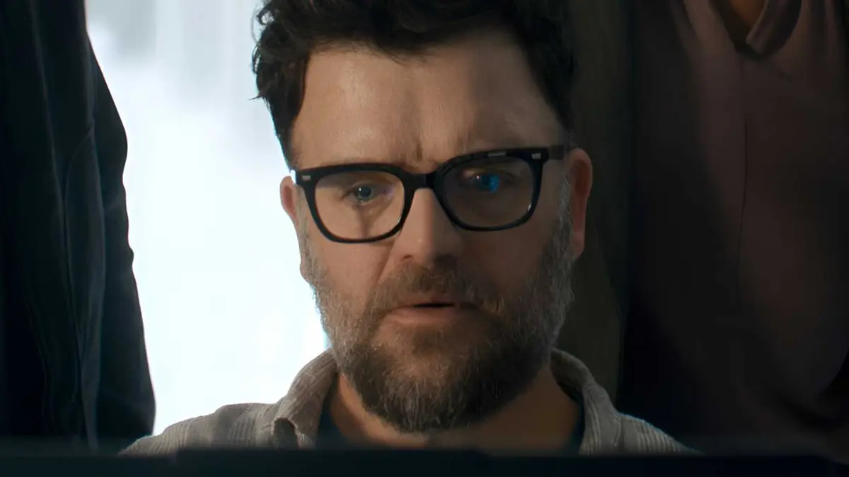 Kevin Weisman‘s Russell working on a laptop in Reacher season 4