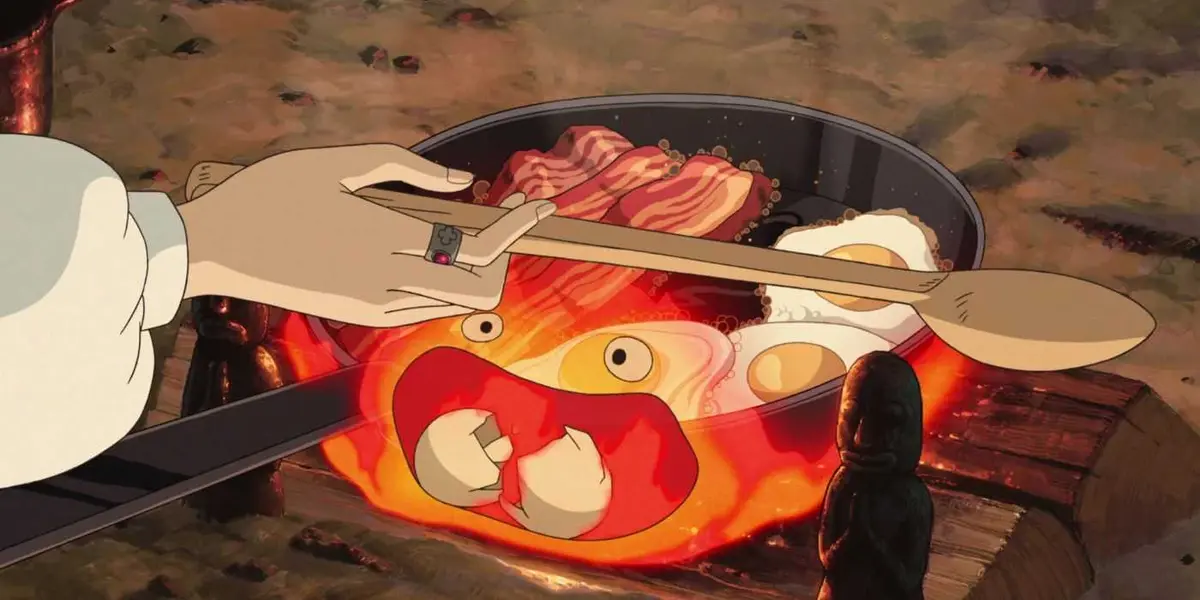 Calcifer is cooking breakfast and eating egg shells in Howl's Moving Castle.