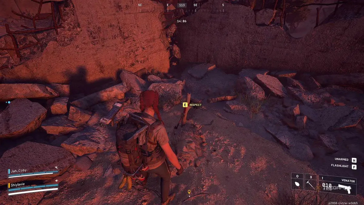 ARC Raiders in the buried city, staring at a grave.