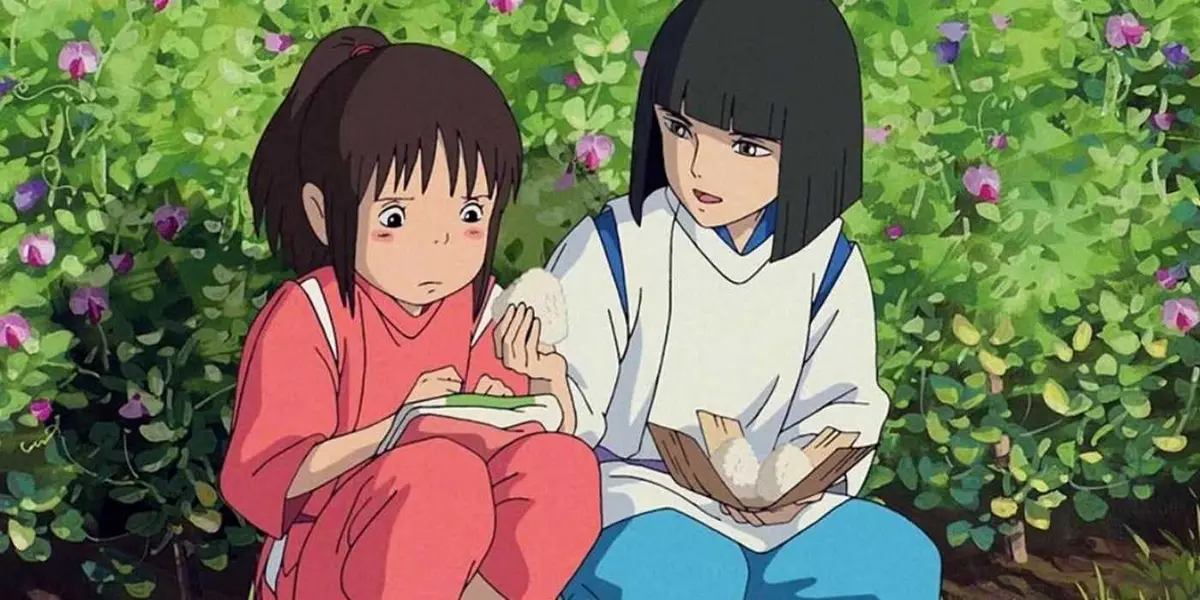 Chihiro and Haku sharing rice cakes in Studio Ghibli's Spirited Away
