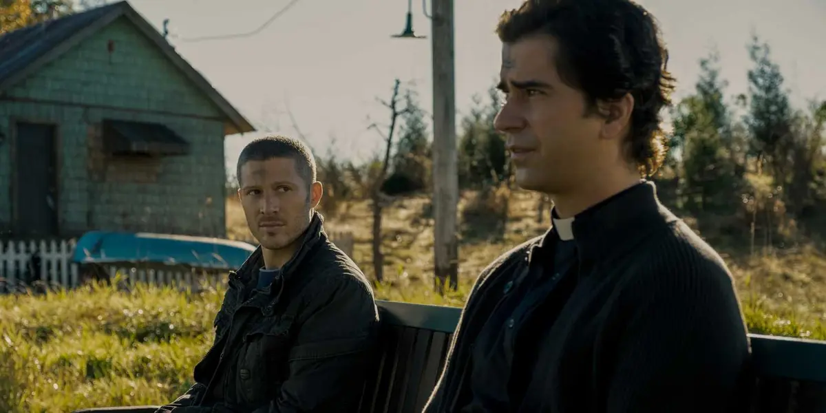 Riley (Zach Gilford) and Father Paul (Hamish Linklater) on Midnight Mass